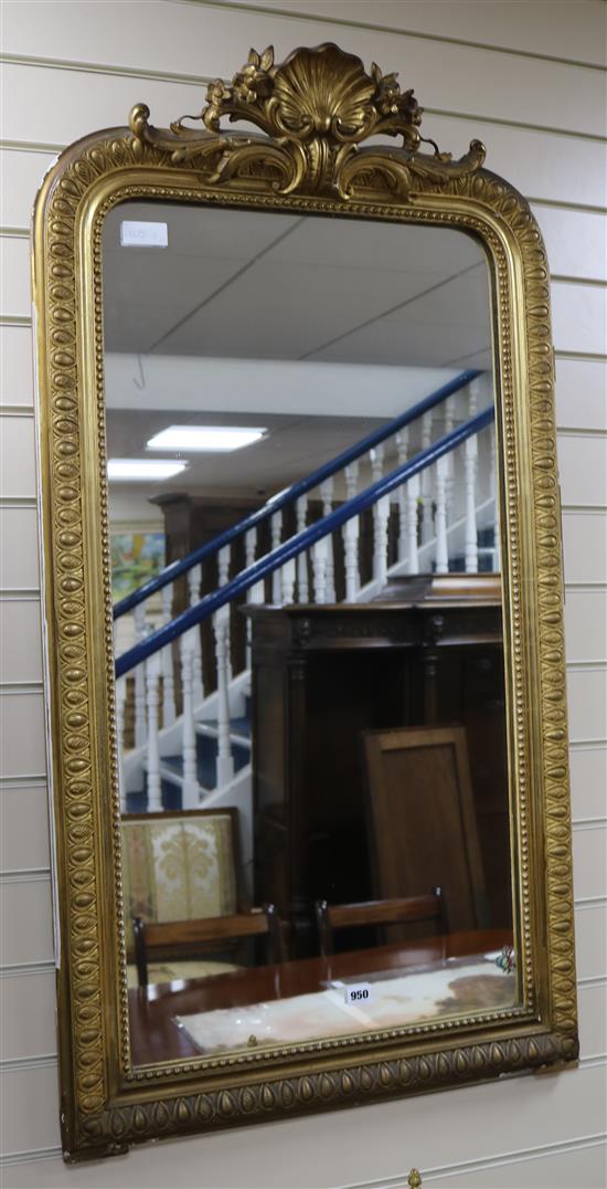 A gilt wall mirror with shell motif W.65cm